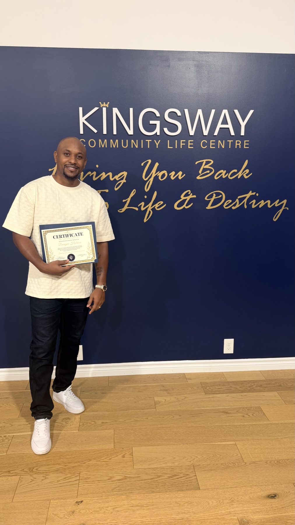 Dwayne Holness with his Certificate of Appreciation at Kingsway Community Life Centre
